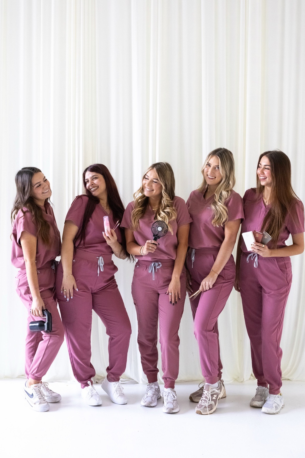 The Rush Beauty Bar team in matching pink outfits